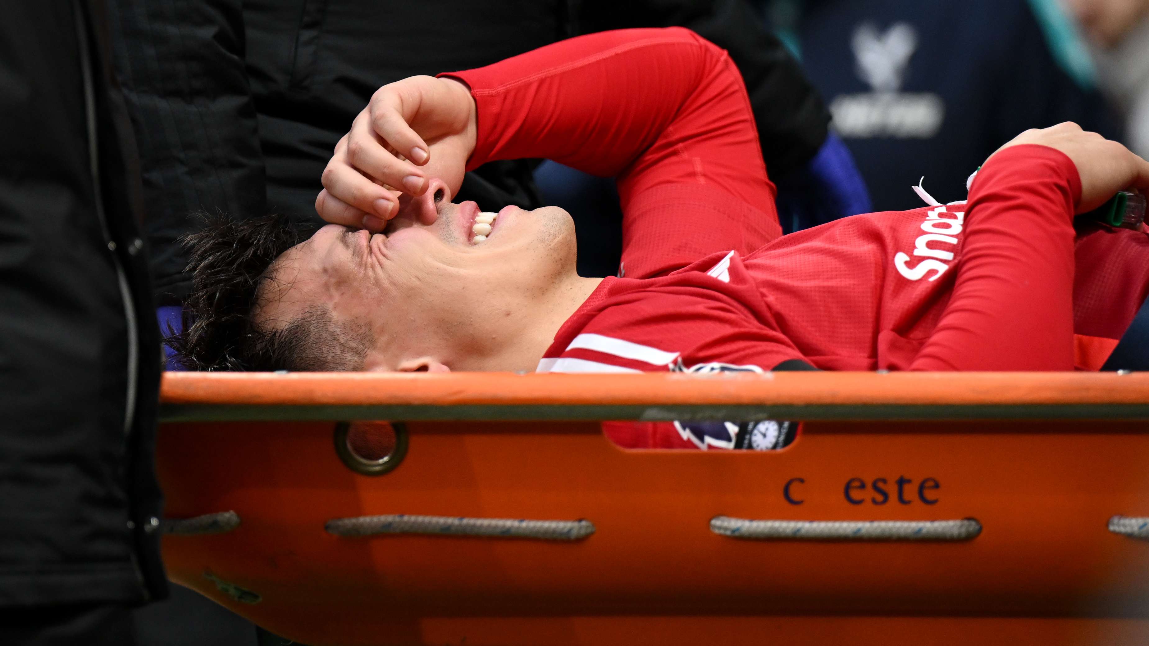 Martinez stretchered off in tears after horror knee injury  